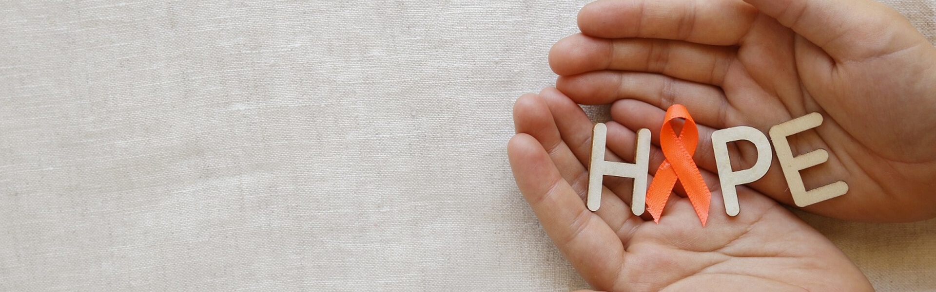 hands holding the letters of hope